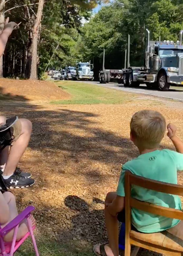 Dade Madison, right, recently celebrated his sixth birthday and to help  mark the special occasion a caravan of tractor-trailer drivers drove in procession, honking along the way. Madison was elated at the efforts drivers went to in order to wish him happy birthday.